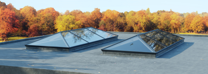 Flat roof with two contemporary glass roof lanterns by SupaLite, providing natural light and modern style to any living space.