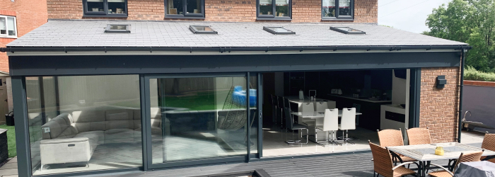 Modern single-storey rear house extension with skylights and open-plan kitchen diner